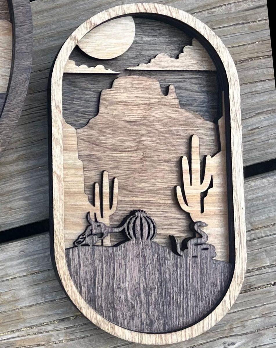 Oval Cactus โ layered wood desert scene
